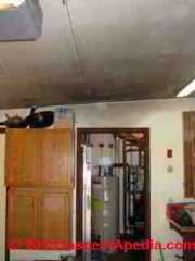 Photograph of oil burner soot on utility area ceilings & walls (C) Daniel Friedman